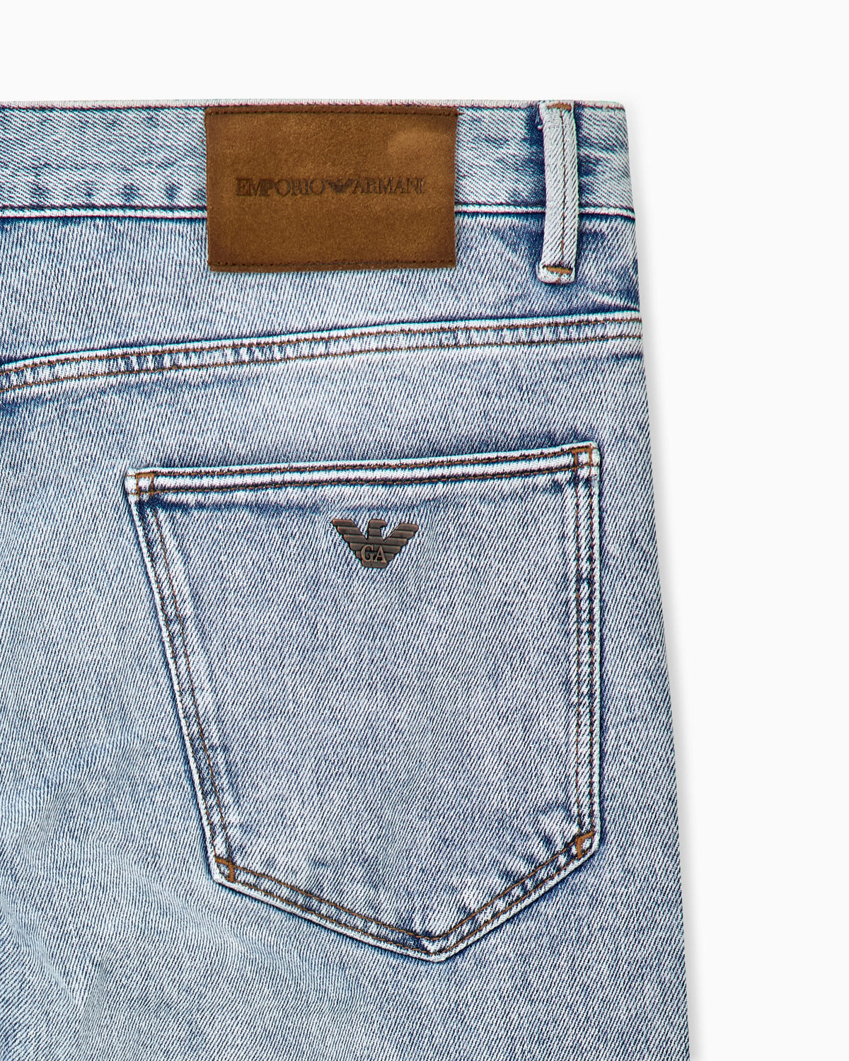 Five-pocket slim fit stone-washed jeans with metallic logo