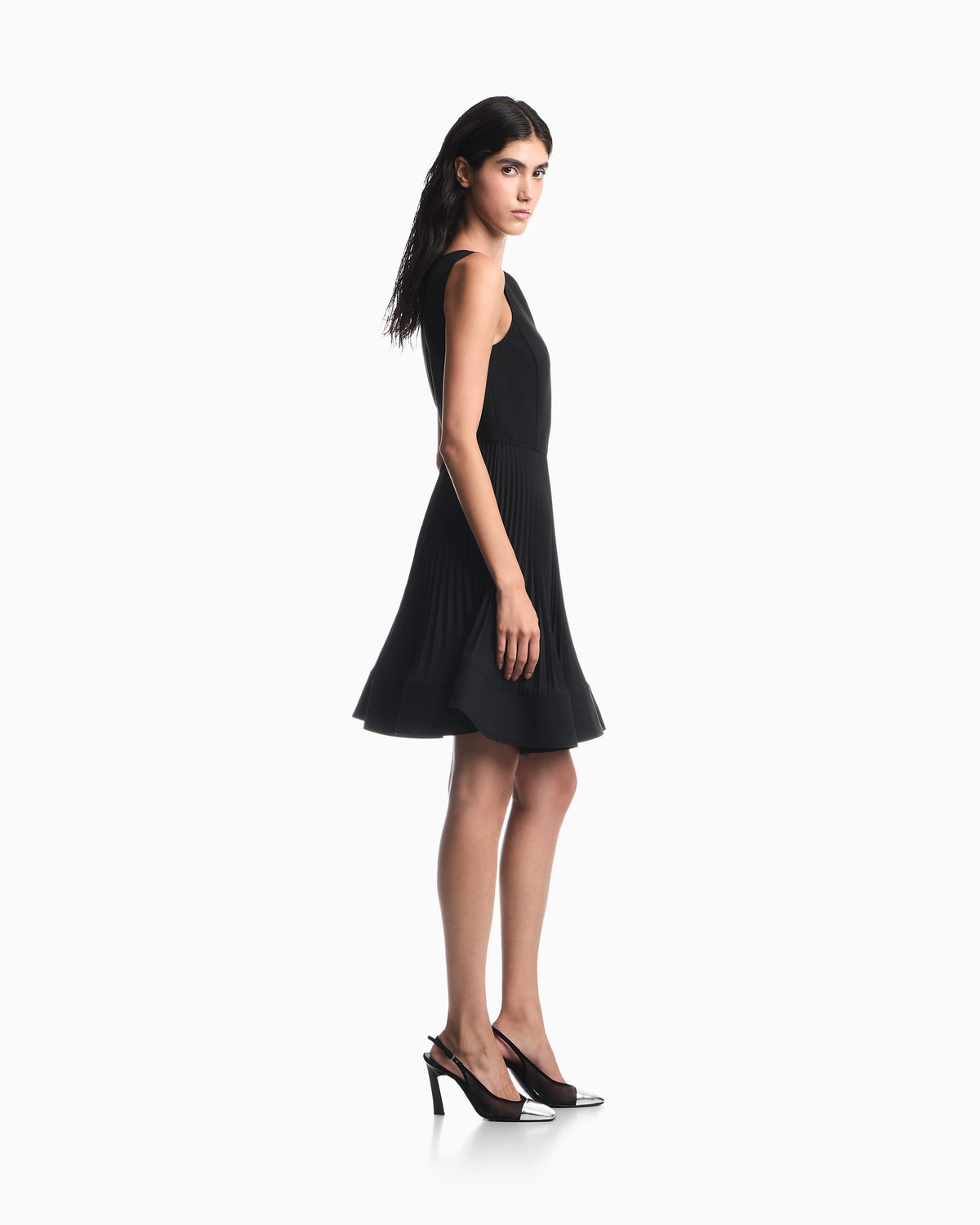 Dress in technical fabric with a pleated skirt