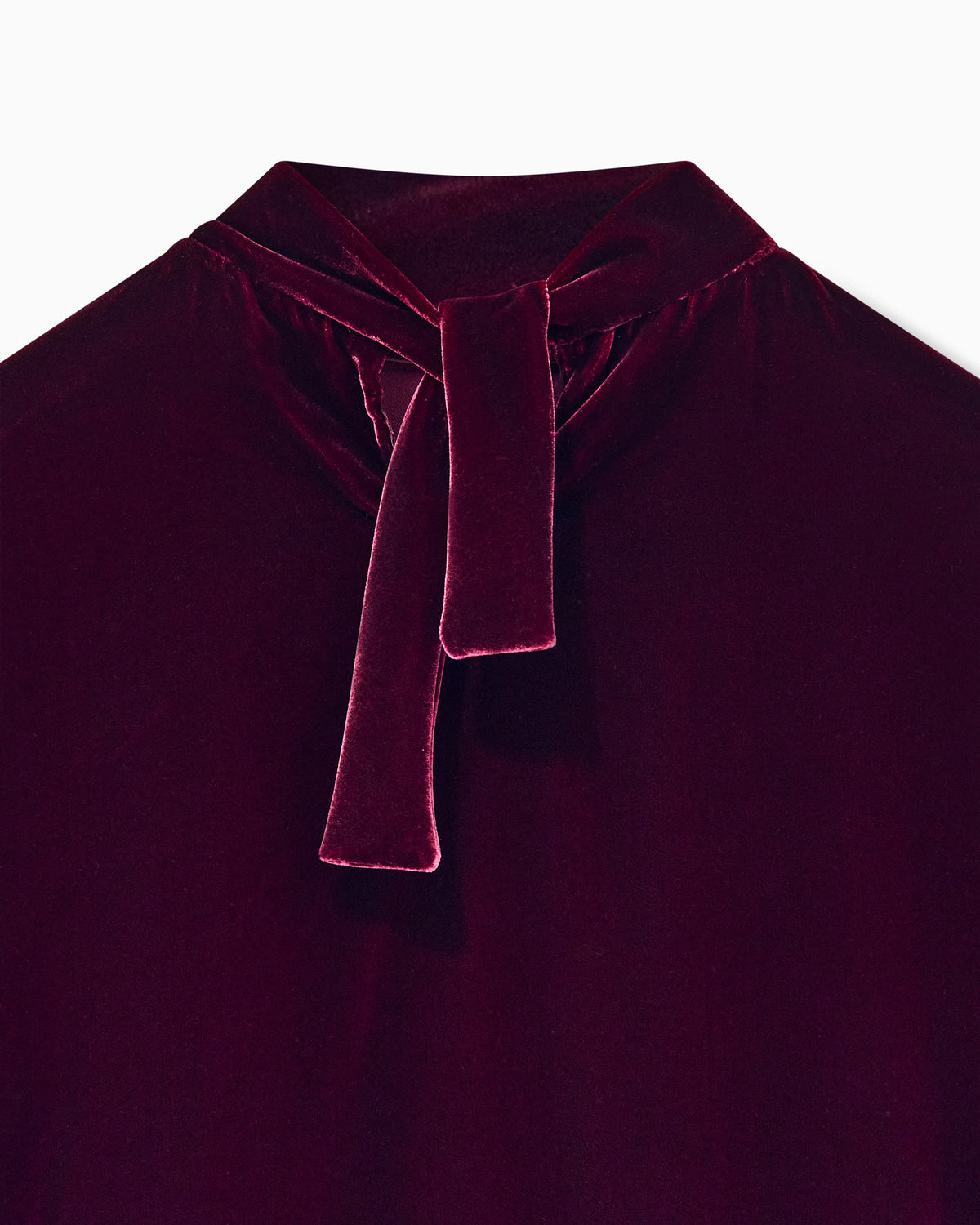 Blouse in velvet with stand-up collar and ribbons