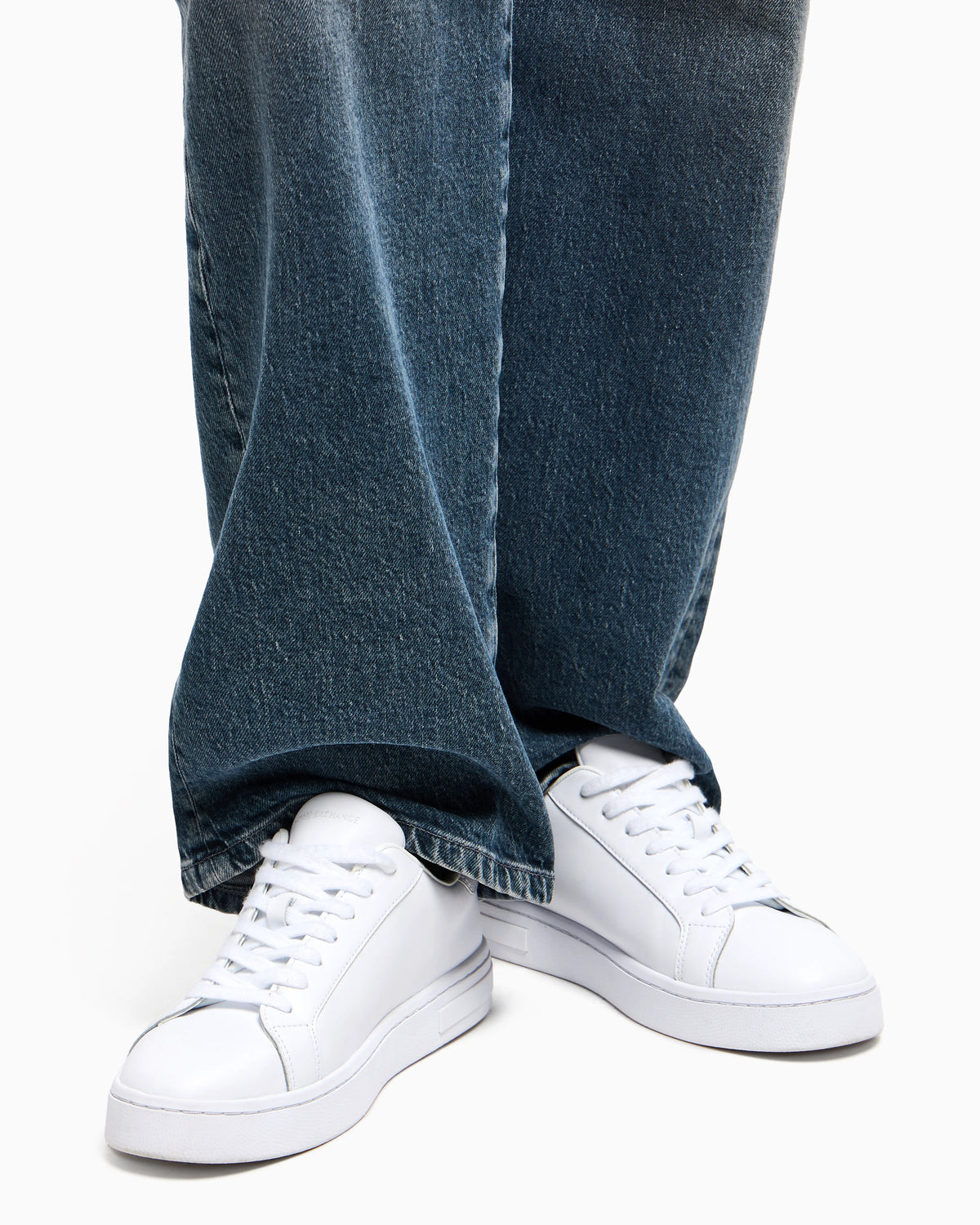 Low-top sneakers in smooth leather with an embossed logo