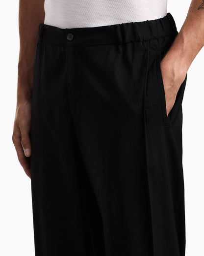 Natural stretch canvas trousers with elasticated cuffs