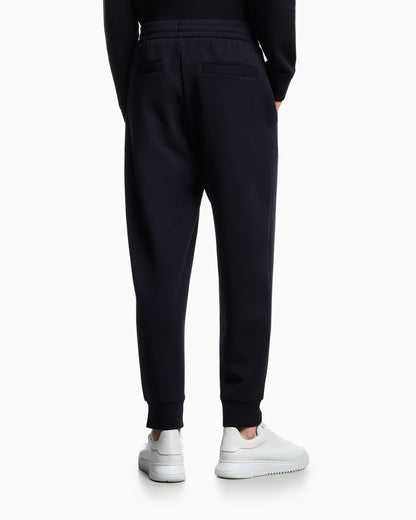 Double-jersey joggers with embossed embroidered EA logo