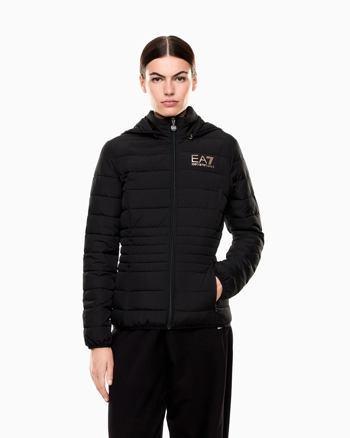 Padded jacket in technical fabric with a hood and zipper