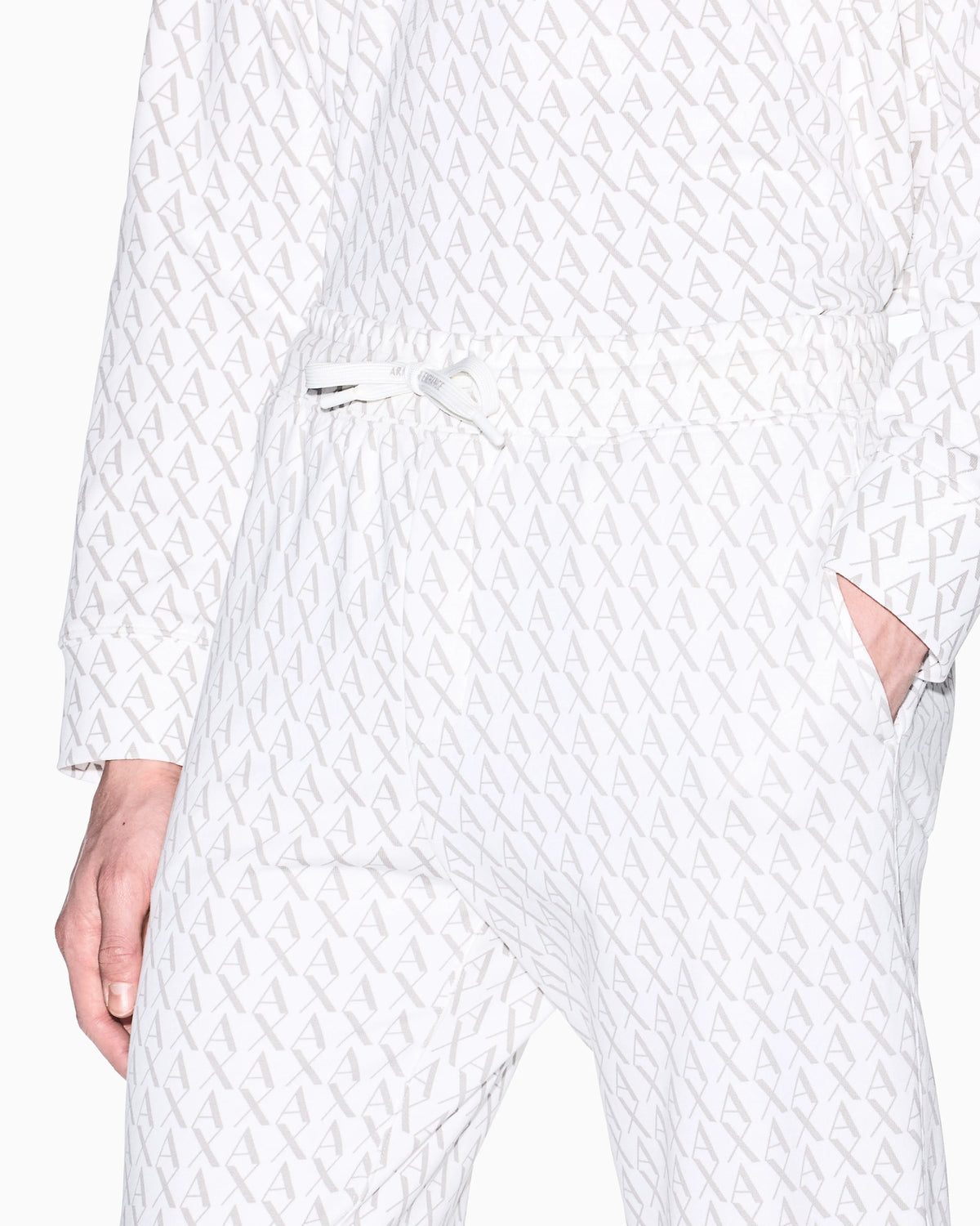 Jogger pants in fabric with allover logo pattern