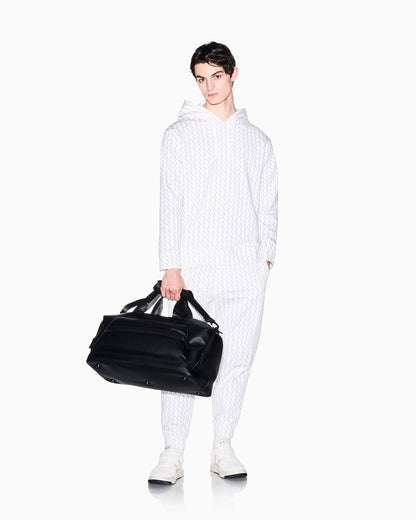 Jogger pants in fabric with allover logo pattern
