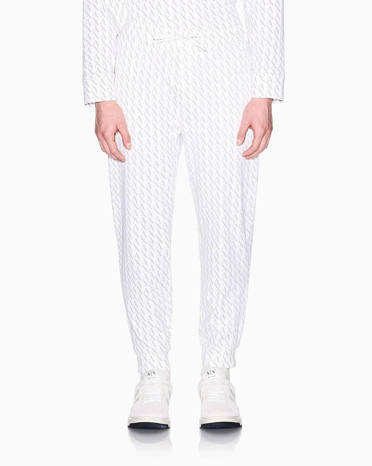 Jogger pants in fabric with allover logo pattern