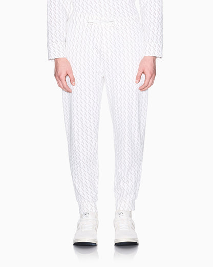 Jogger pants in fabric with allover logo pattern