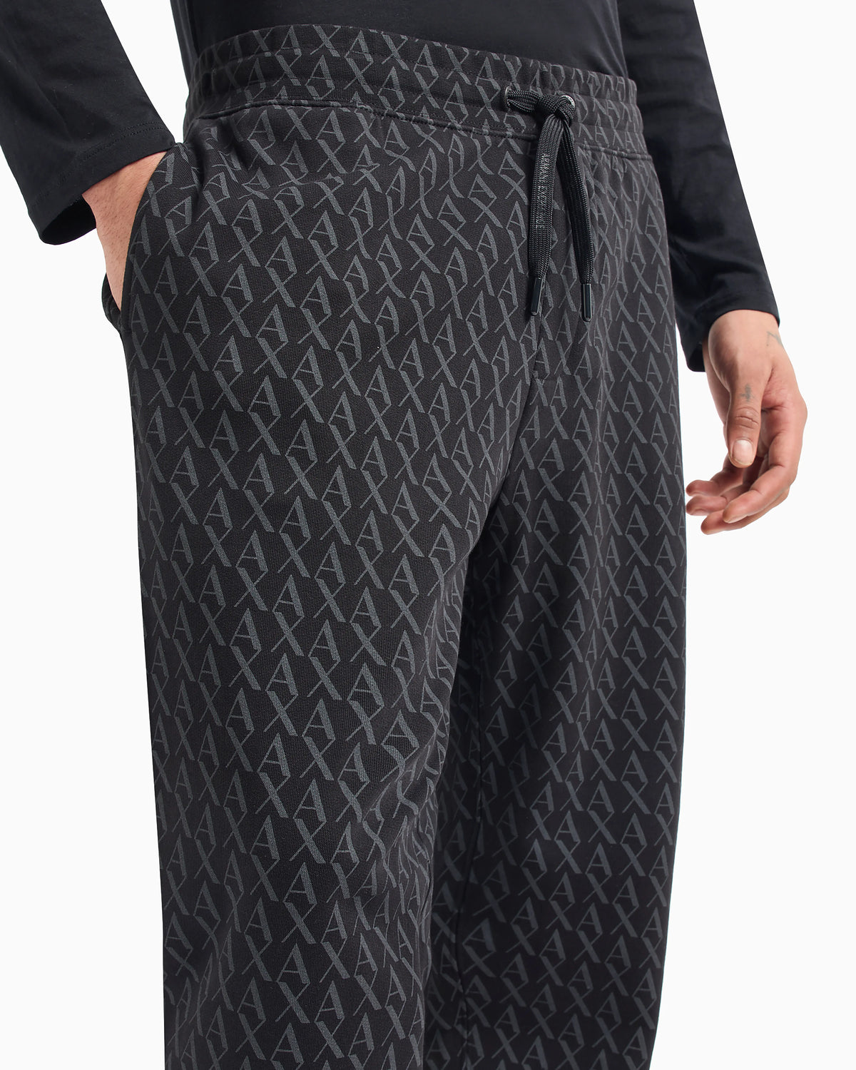 Jogger pants in fabric with allover logo pattern