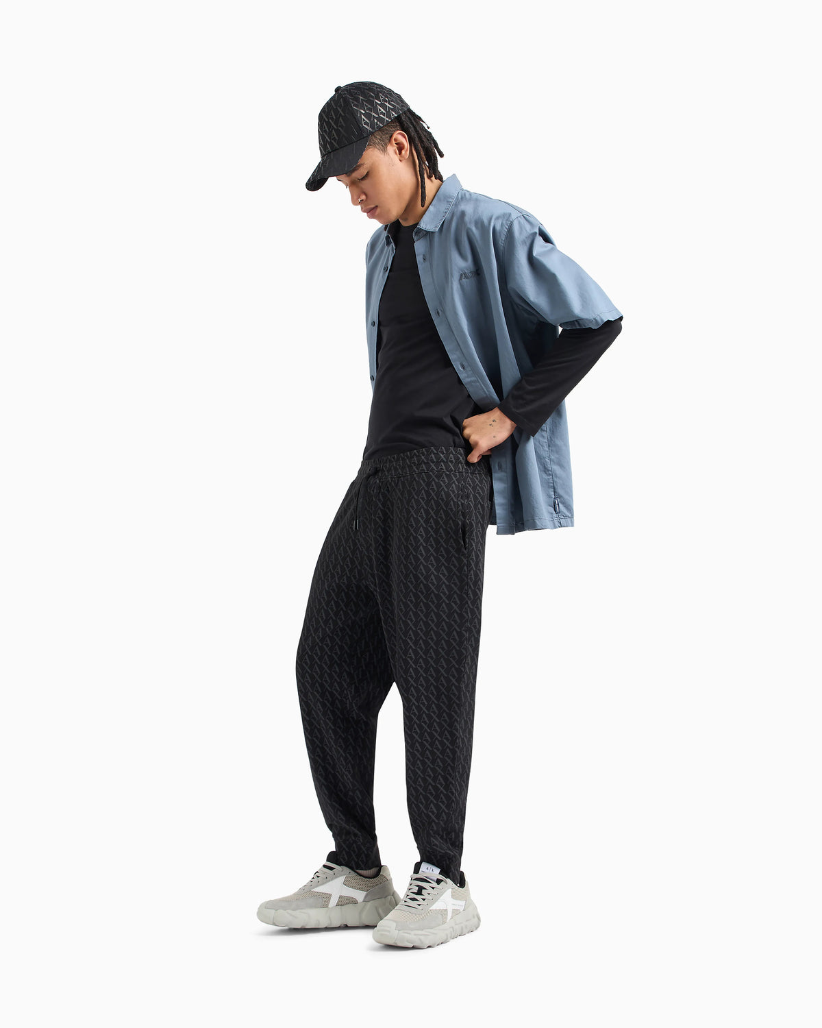 Jogger pants in fabric with allover logo pattern