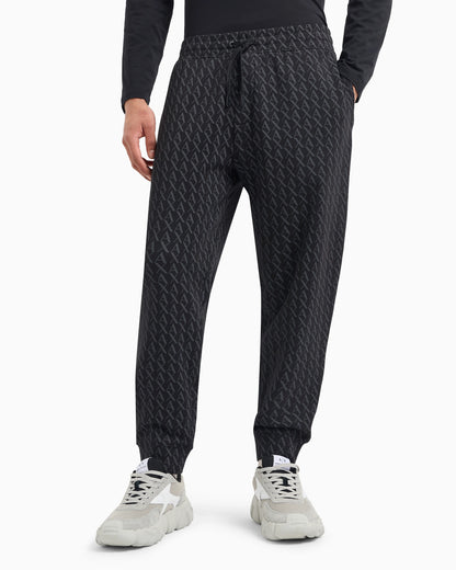 Jogger pants in fabric with allover logo pattern