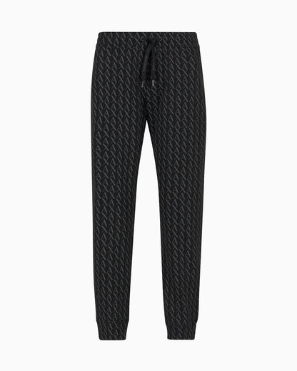 Jogger pants in fabric with allover logo pattern