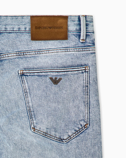 Five-pocket slim fit stone-washed jeans with metallic logo