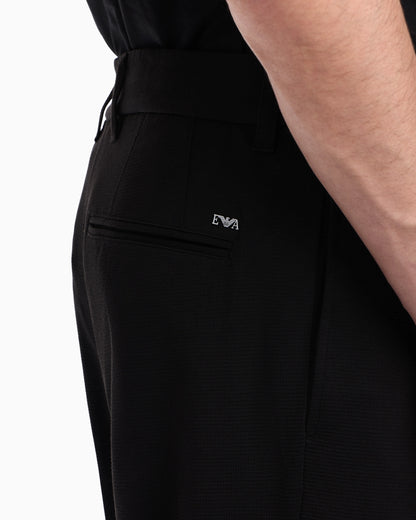 Waffle-effect armure fabric trousers