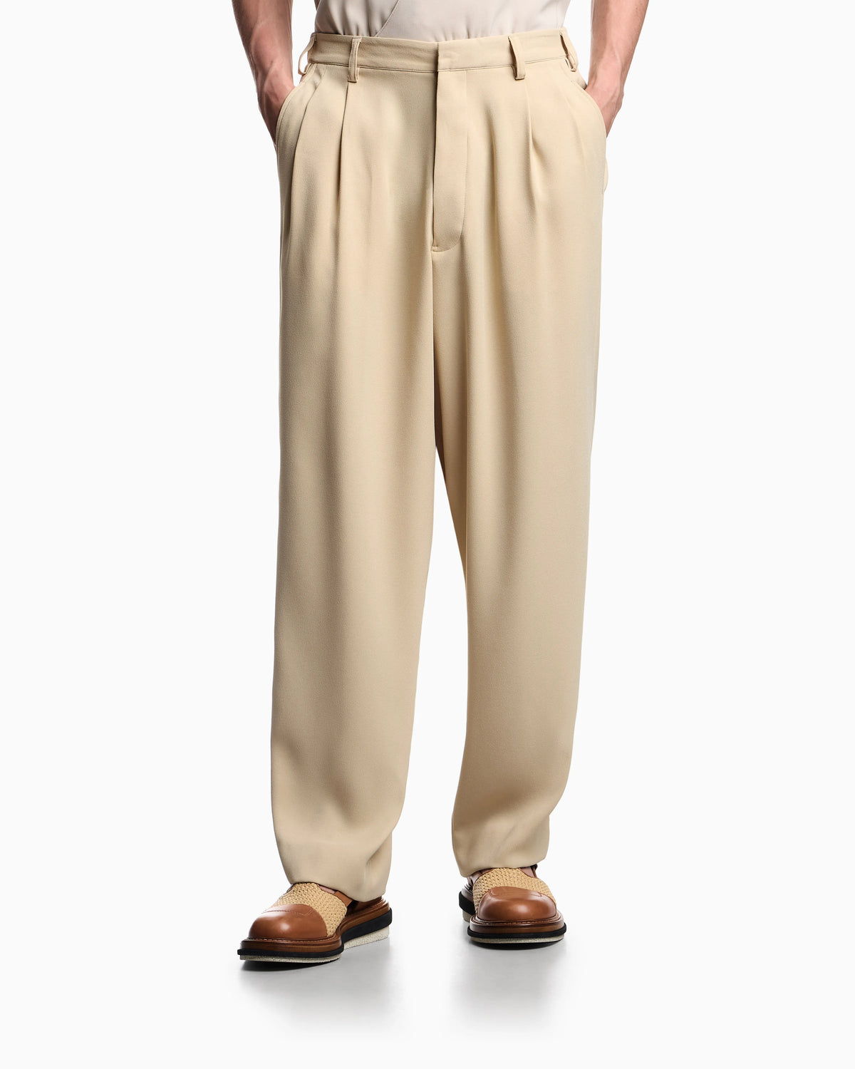 Fluid sandblasted fabric trousers with pleats
