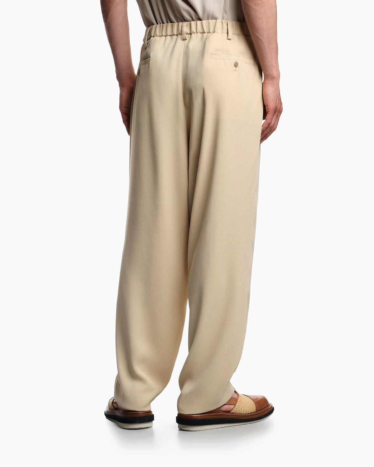 Fluid sandblasted fabric trousers with pleats