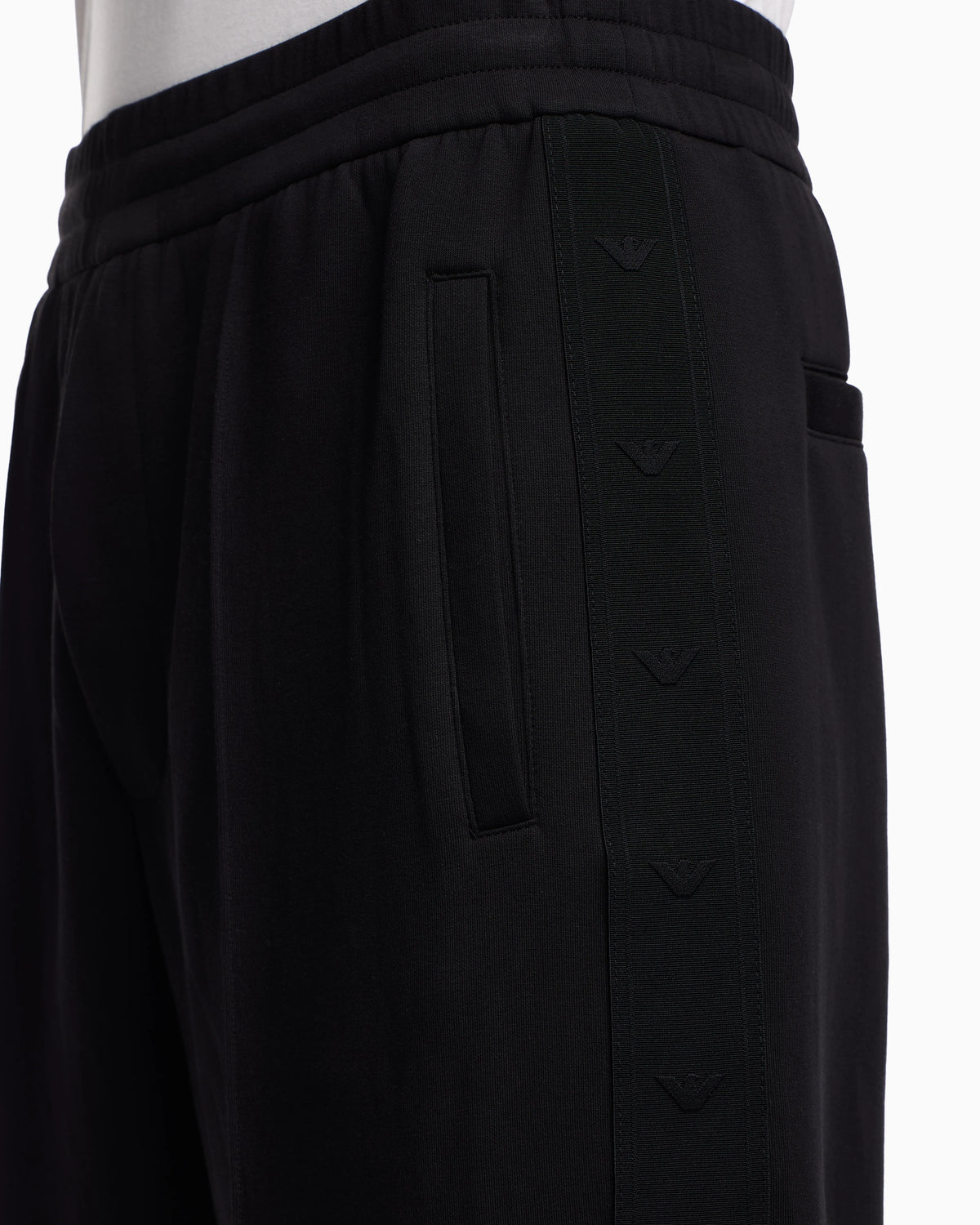 Double-jersey trousers with micro eagle logo band