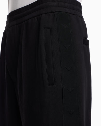 Double-jersey trousers with micro eagle logo band