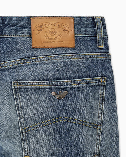 Straight-leg denim jeans with faded wash and whiskering