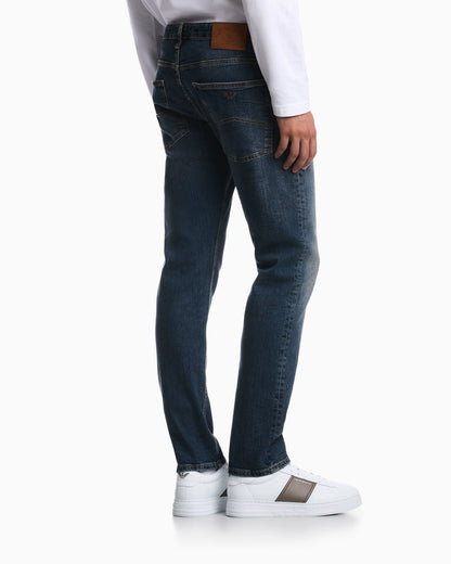 Straight-leg denim jeans with faded wash and whiskering