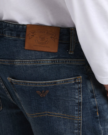 Straight-leg denim jeans with faded wash and whiskering