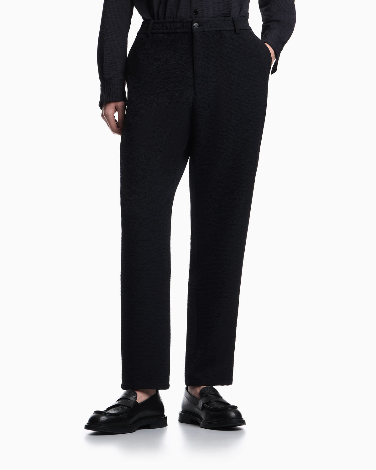 Icon embossed pattern-fabric trousers