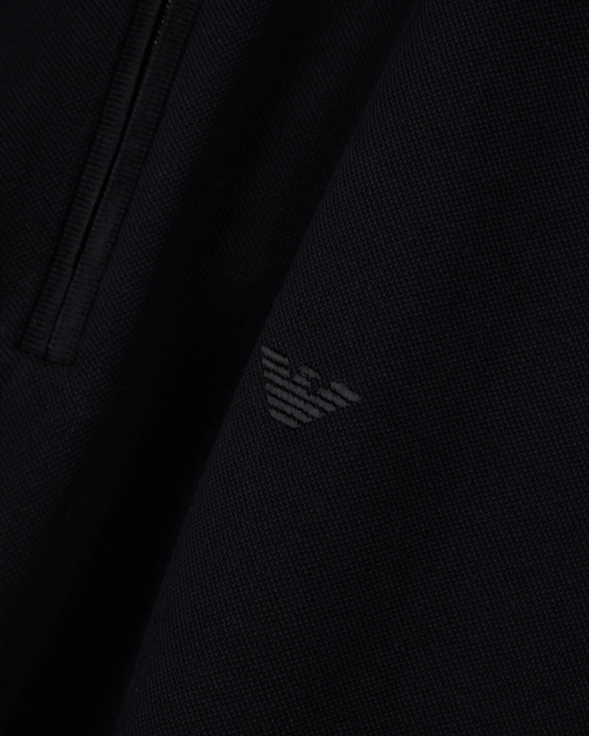 Polo shirt in piqué with partial zip