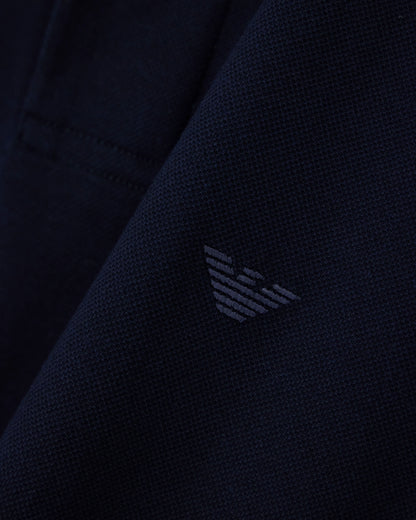 Piqué polo shirt with stripe detail on the collar
