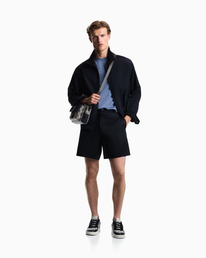 Blouson jacket with high collar and angled flap pockets