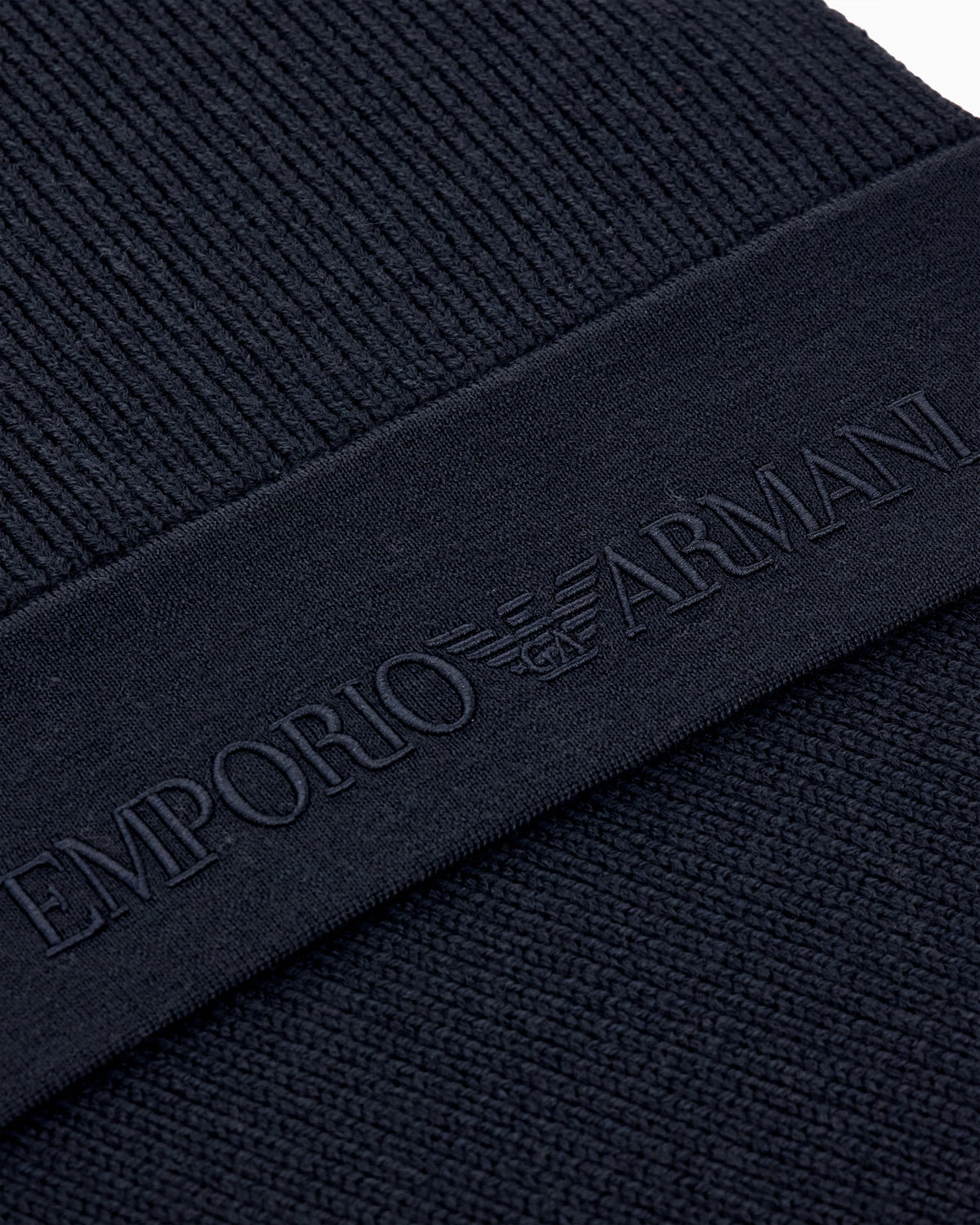 Ribbed virgin wool scarf with an embossed logo