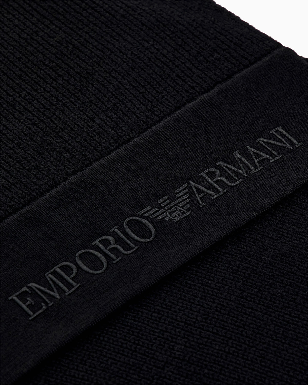 Ribbed virgin wool scarf with an embossed logo
