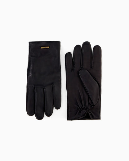 Leather gloves with a metal logo plate and wool lining