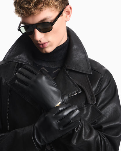 Leather gloves with a metal logo plate and wool lining