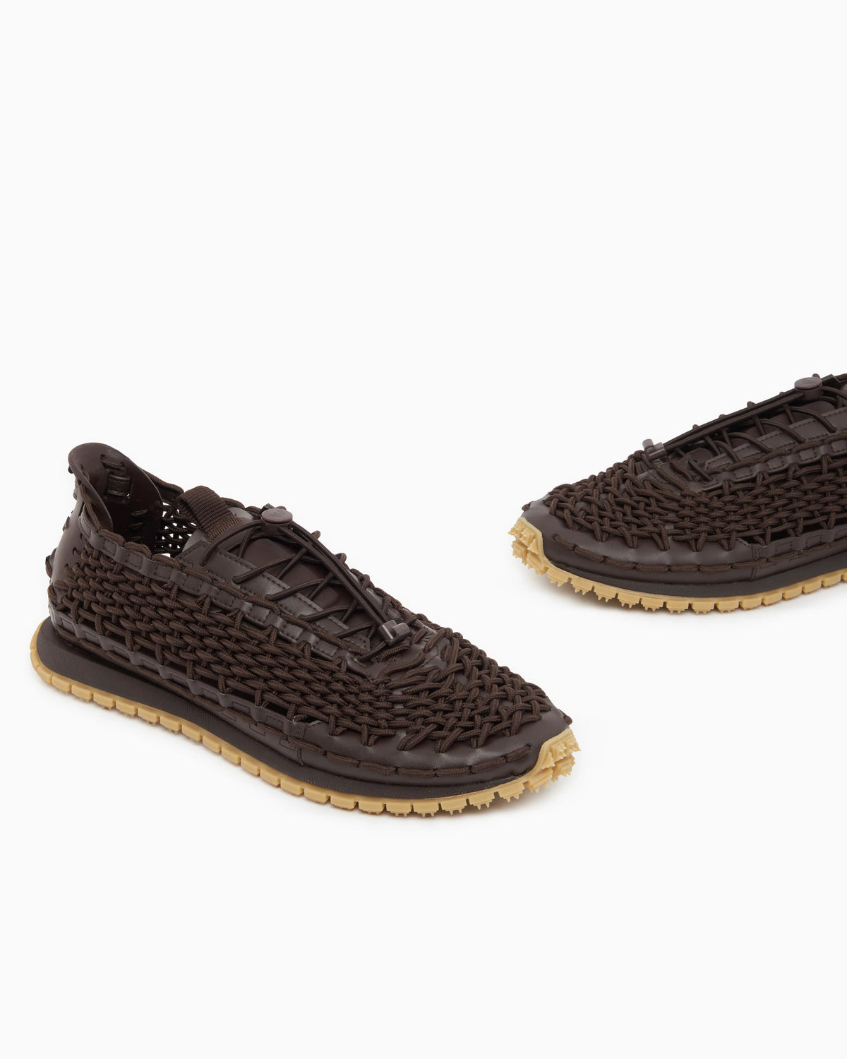 Sneakers with woven design and rugged rubber sole
