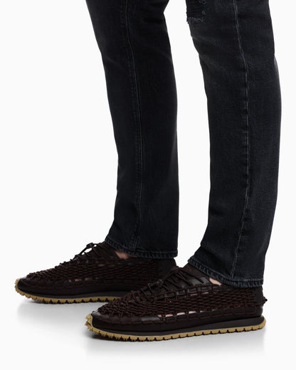Sneakers with woven design and rugged rubber sole