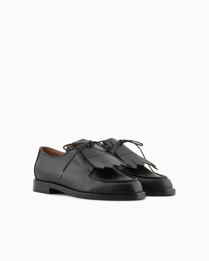 Leather lace-ups with fringes