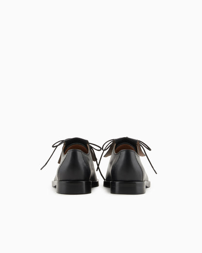 Leather lace-ups with fringes