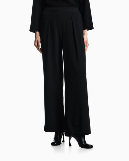 Stretch sandblasted fabric trousers with pleats