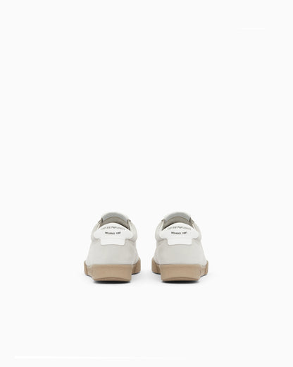 Nubuck sneakers with perforated details and a rubber sole