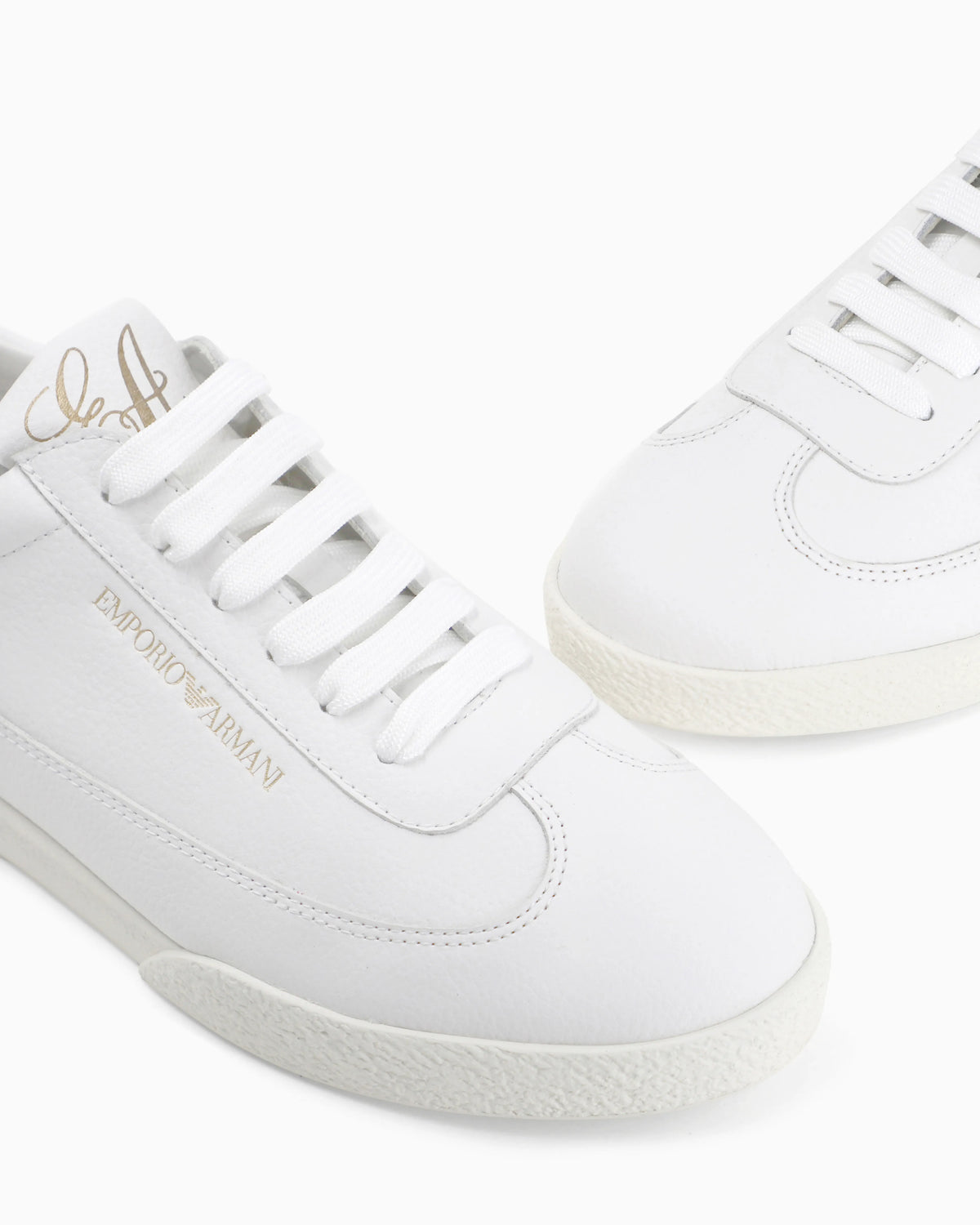 Leather sneakers with an embossed logo and a rubber sole