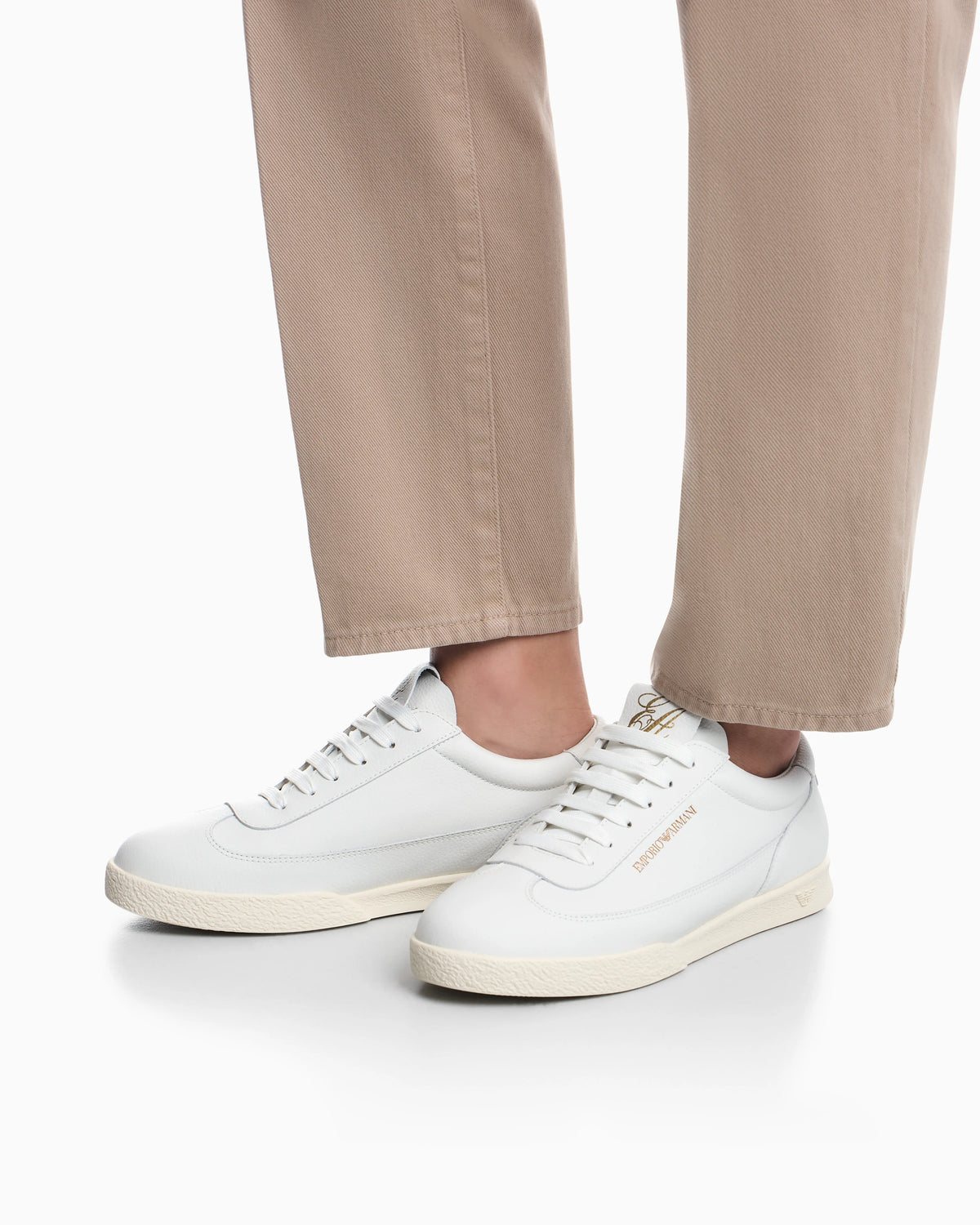 Leather sneakers with an embossed logo and a rubber sole
