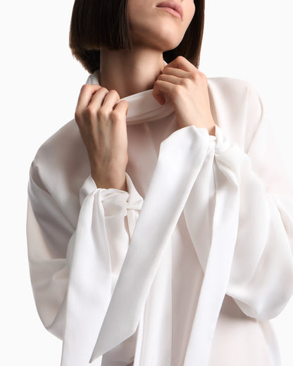 Blouse in recycled crepe with high neckline and tie cuffs