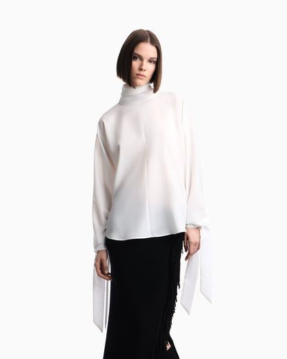 Blouse in recycled crepe with high neckline and tie cuffs