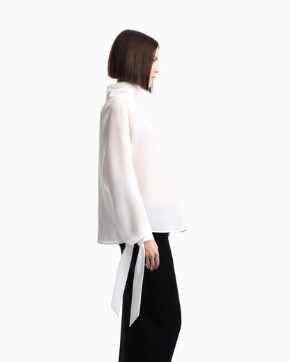 Blouse in recycled crepe with high neckline and tie cuffs