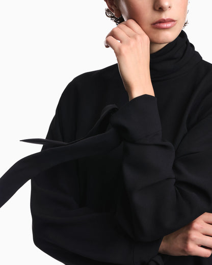 Blouse in recycled crepe with high neckline and tie cuffs