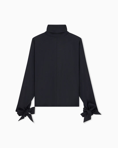 Blouse in recycled crepe with high neckline and tie cuffs
