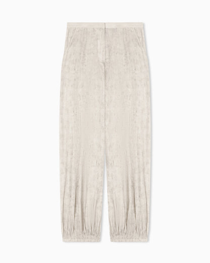 Flowing fabric trousers with a mottled-effect print