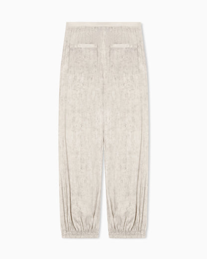 Flowing fabric trousers with a mottled-effect print