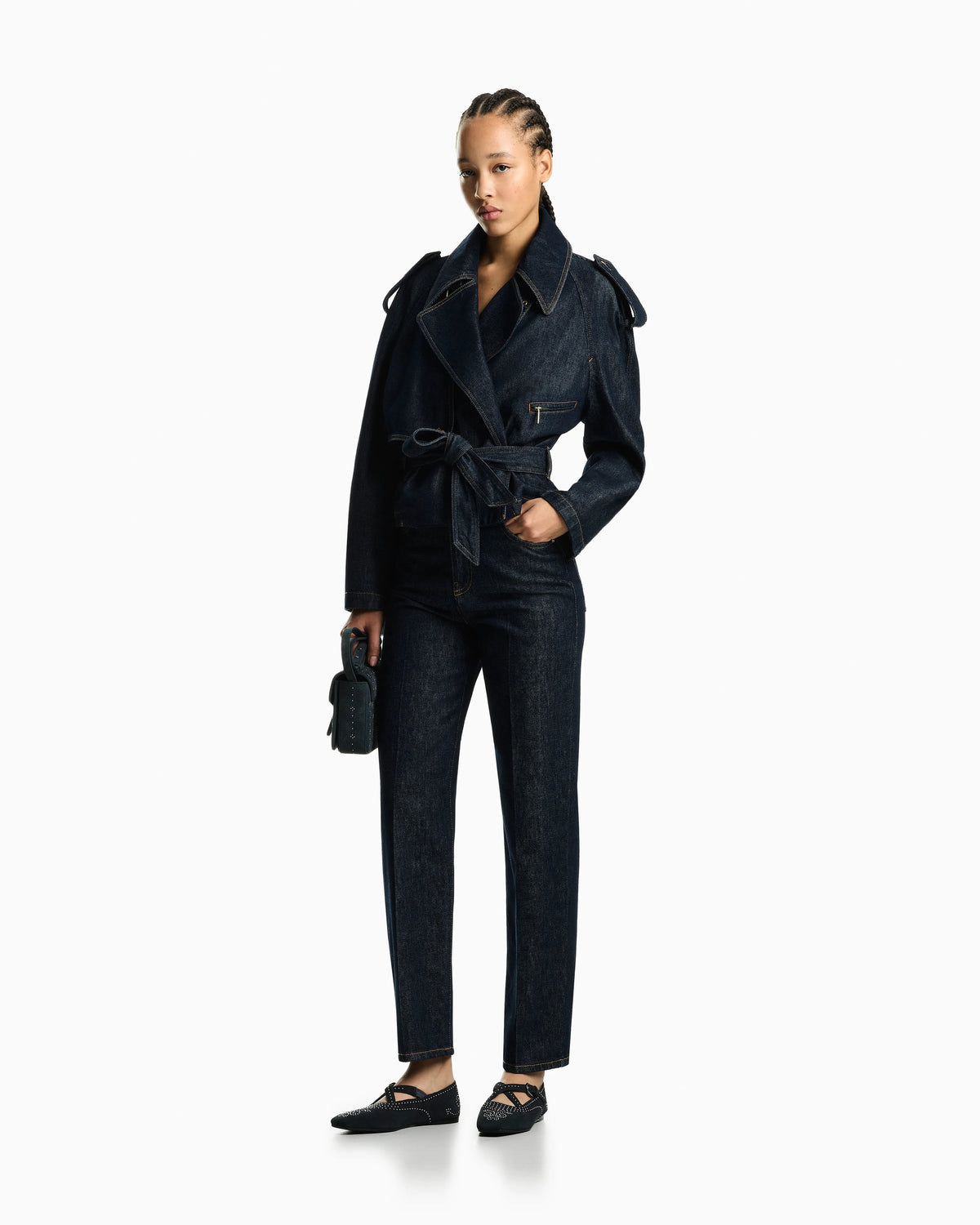Five-pocket denim jeans with a metal knot on the waistband