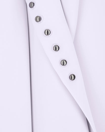 Unlined top in techno cady with stud rivets and buttonholes