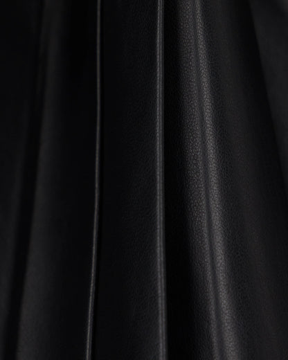 Flared leather miniskirt with front pleats and dual belts